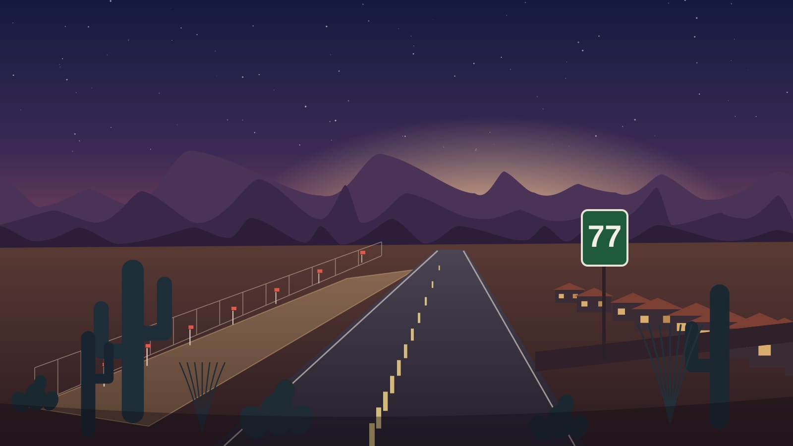 An illustrative dusk scene of a desert highway running north toward layered purple mountain ridgelines under an amber-to-indigo Sonoran sunset — a flat graded dirt pad edged with a chain-link fence and red-flagged survey stakes on the left, a cluster of low tile-roofed houses with lit windows on the right, saguaros, ocotillo and prickly pear along both shoulders, and a green highway shield reading 77 on a post beside the road.